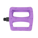 A purple Odyssey Twisted PC Pro Pedal features a rectangular shape, two cutouts, durable nylon composite body, oversized grip pins, and a black left threaded spindle.