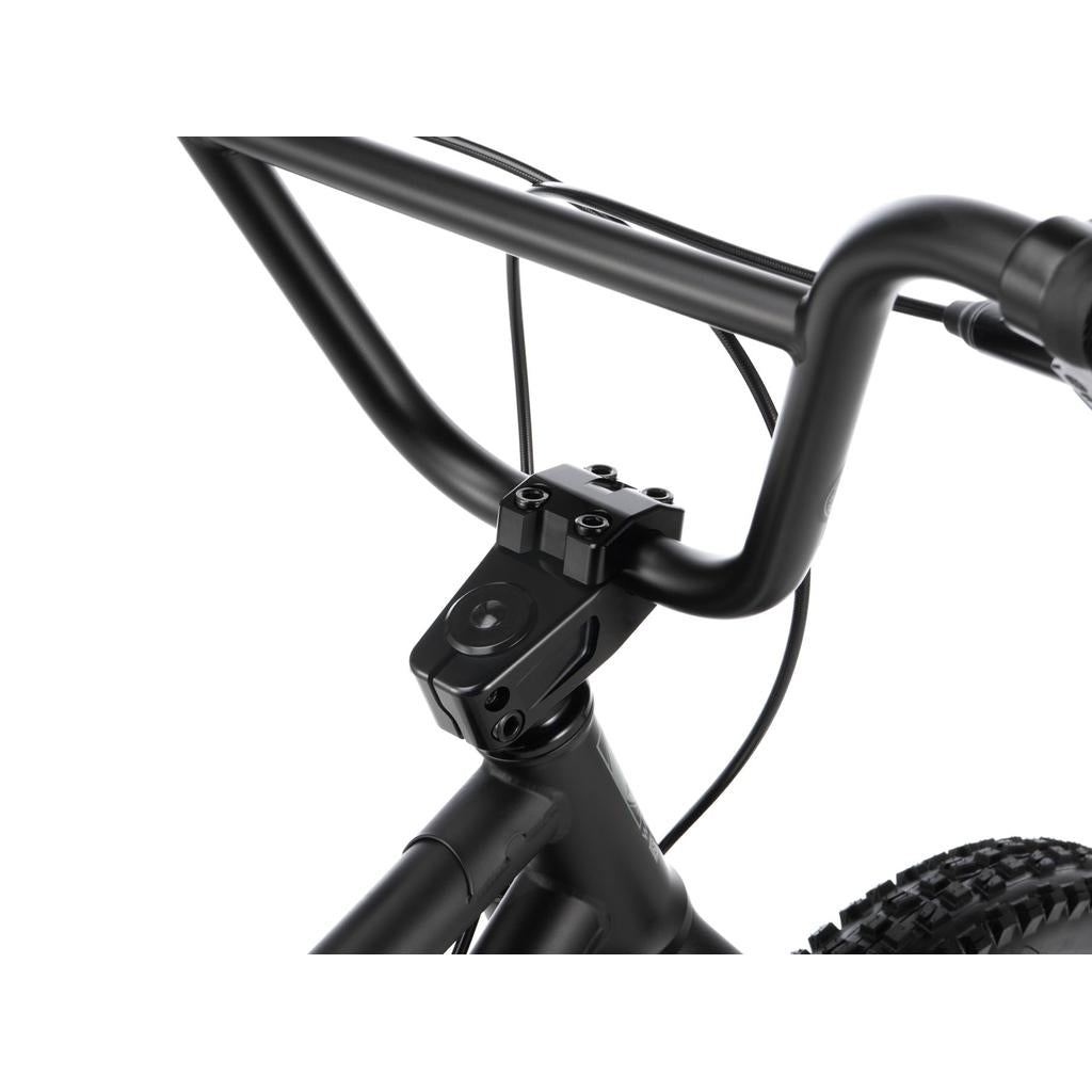 Close-up of matte black handlebars, stem, and headset on a Wethepeople Swampmaster 20 Inch Bike (Rock Shox Shock) downhill mountain bike.