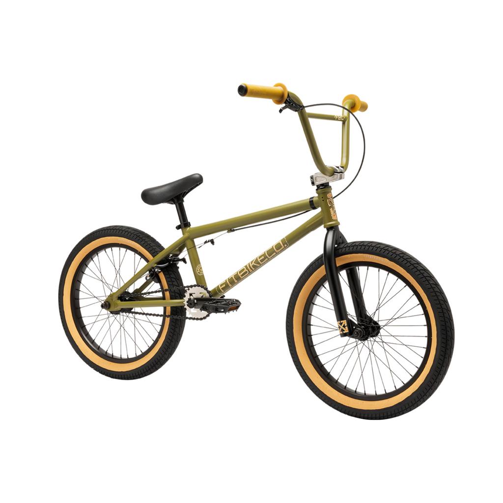The Fit Bike Co Misfit 18 Inch Bike is a green youth BMX with yellow handlebars and tires, black seat, pedals, and front fork, plus a lightweight frame—all shown on a white background.