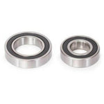 The WETHEPEOPLE Helix V3 Hub Bearing Set includes two metal ball bearings—one large, one small with black seals—perfect as replacement bearings for WETHEPEOPLE rear hubs or Helix V3 hubs.