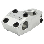 The Cinema Analog Low Top Load Stem features a silver finish, six black bolts, "CINEMA" engraving on the front, and a handlebar clamp—expertly crafted from durable 6061-T6 aluminum in Cinema’s classic design.