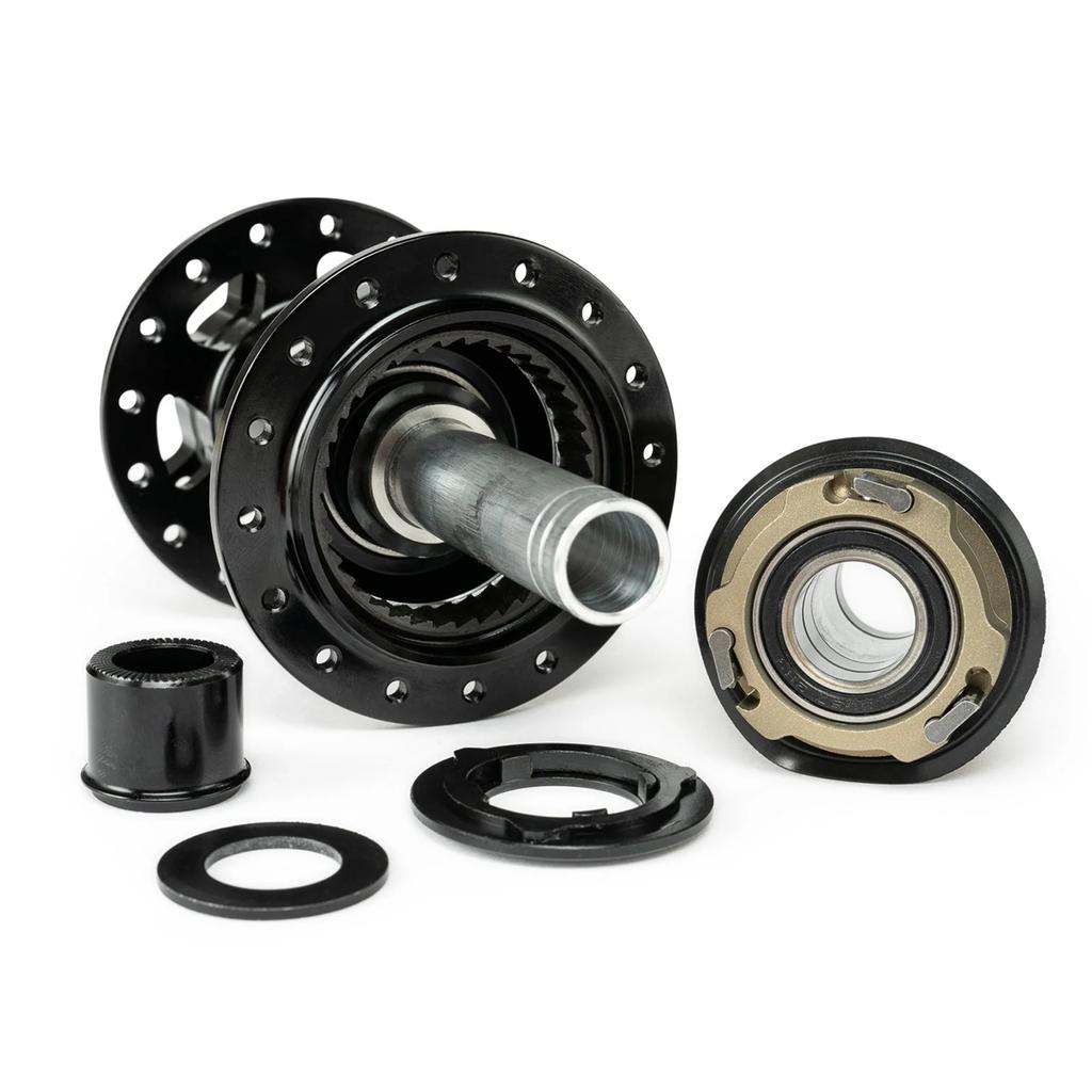 Disassembled Radio Sonar 148 Rear Hub showing its internal gear mechanism, axle, and multiple metal components arranged on a white background.