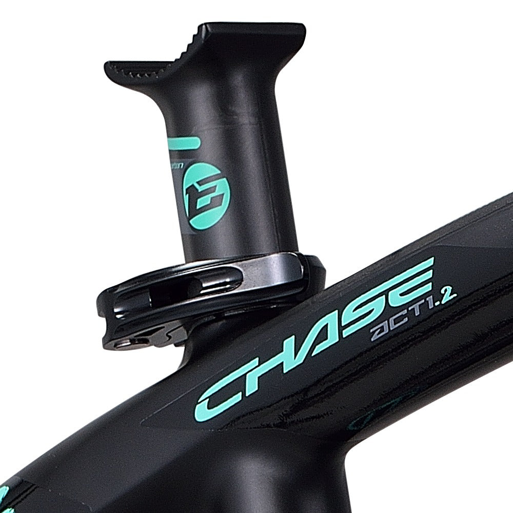 A black bike with a green logo on the handlebar featuring the Chase ACT 1.2 Carbon BMX Race Frame Pro XXL+ technology.