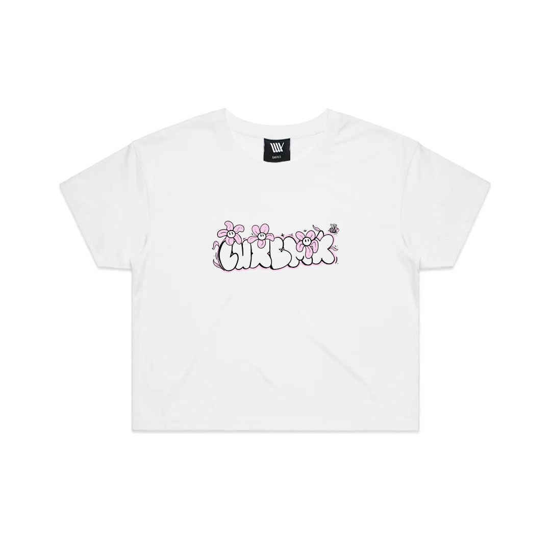 The LUXBMX Ali Crop Tee is a white cropped t-shirt with a floral design, "CHAOS" in bubble letters, pink flowers, and a butterfly graphic—made from a breathable cotton blend for all-day comfort.
