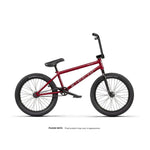 A Wethepeople Crysis 20 Inch Bike in red with black handlebars, seat, and tires is shown on a white background. Text below states the final product may look different.