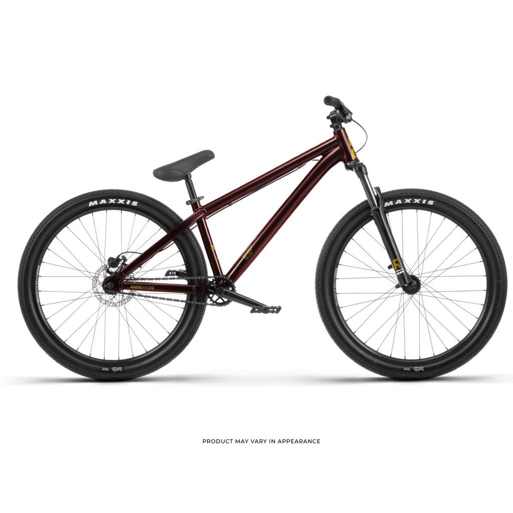 Side view of a maroon Radio Griffin 26 Inch Dirt Jumper Bike featuring a sloping top tube, flat handlebars, black saddle, and Maxxis DTH tyres on a white background.