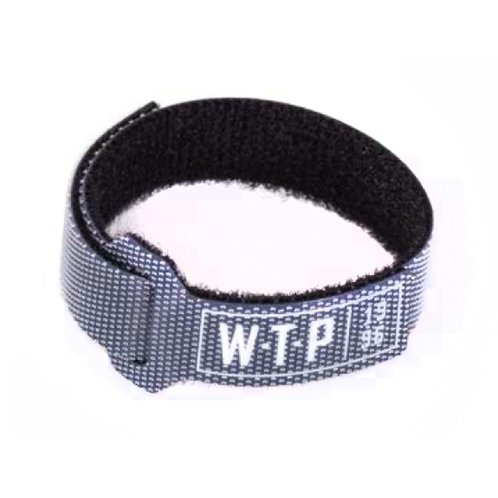 The Wethepeople Team 1996 Brake Cable Strap is a black and grey adjustable velcro strap with “WTP” and “19 36” on the label, perfect for keeping your brake cable organized and protected from scratches.