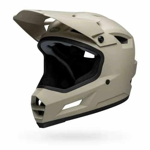 The Bell Sanction 2 Matte Cement helmet, shown in side profile, features a black visor and multiple air vents—an ideal entry-level choice for motocross or BMX riders seeking style and protection.