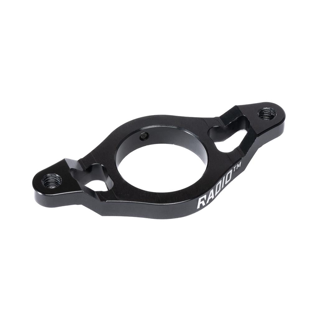 The Radio Aeon Gyro Rotor Plate is a black metal MTB gyro plate, CNC machined from 6061-T6 alloy, featuring two side mounting holes and "RADIO" engraved on the edge, shown isolated on a white background.