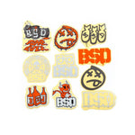 The BSD 2021 Mixed 10 Piece Sticker Pack includes assorted bike stickers with graffiti-style text, faces, bottles, and a cartoon devil character—ideal for sticker enthusiasts looking to customize their ride.