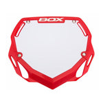 A Box Two Phase 1 Number Plate Large in red and white plastic, designed for a BOX Component motocross or BMX bike, featuring multiple attachment points. Ideal for riders in the UCI/GSX Super Cross Series.