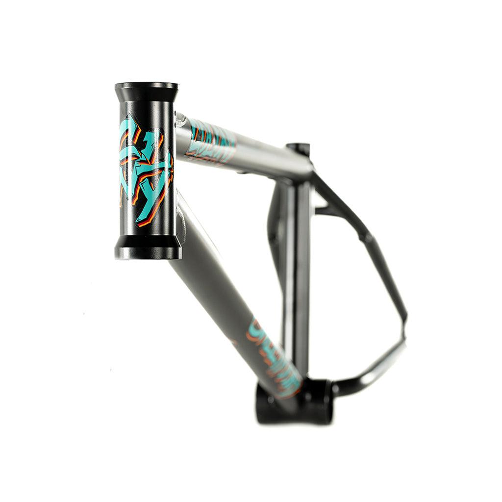 A black Colony 2024 Sweet Tooth Frame with a blue and orange design from the Sweet Tooth Range.