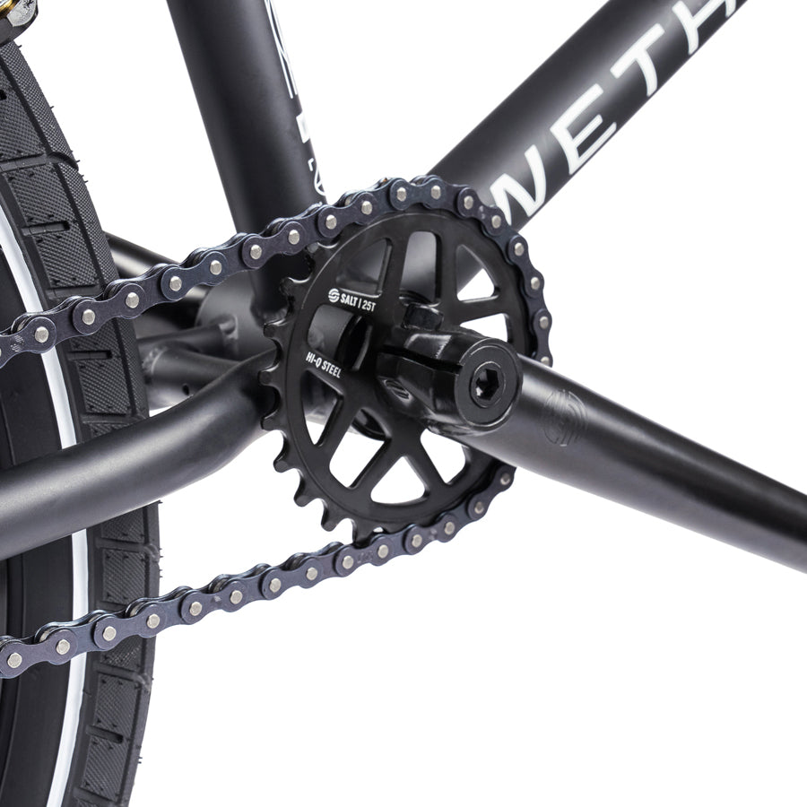 A close up of a Wethepeople Nova 20 Inch BMX Bike with chain and gears.