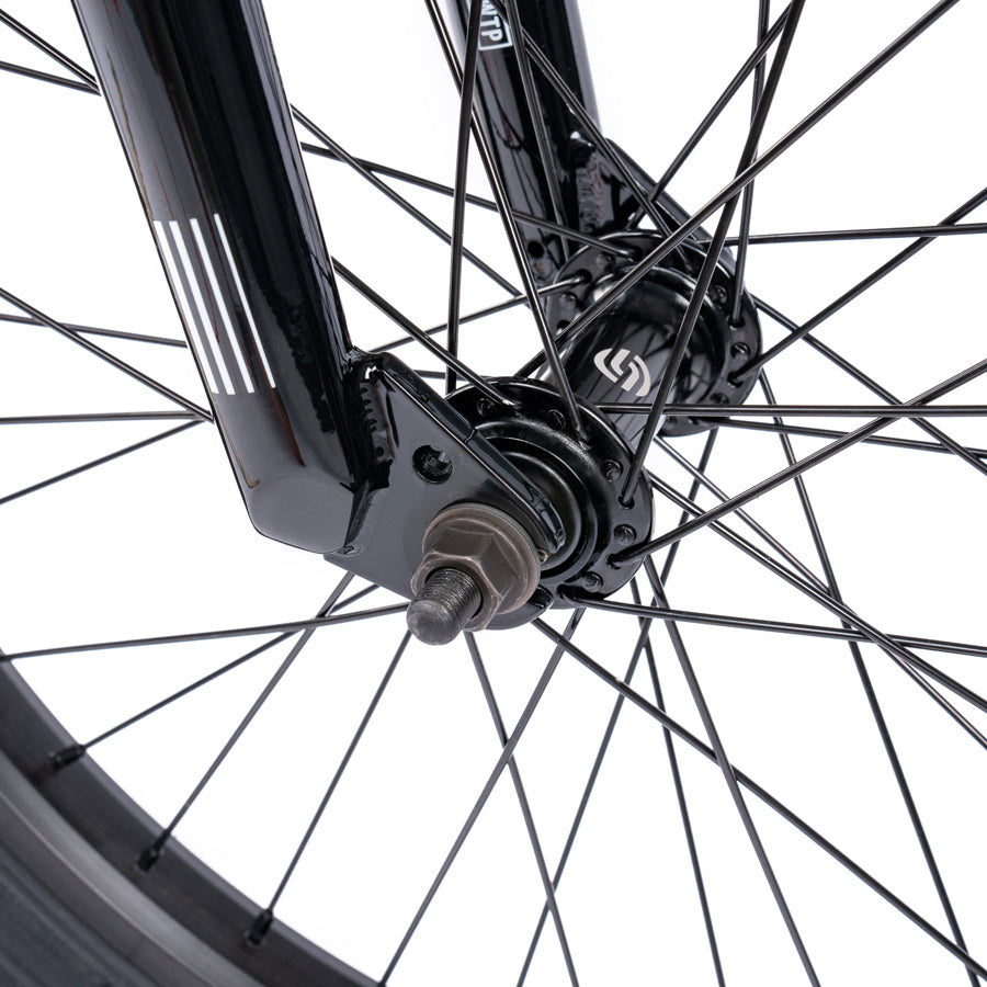A close up view of a black Wethepeople Nova 20 Inch BMX Bike wheel.