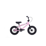 The Cult Juvi 12 Inch Bike is a small pink kids' BMX with an aluminium frame, black handlebars, seat, pedals, and tires plus white accents—a stylish bike for young riders. Shown on a white background.