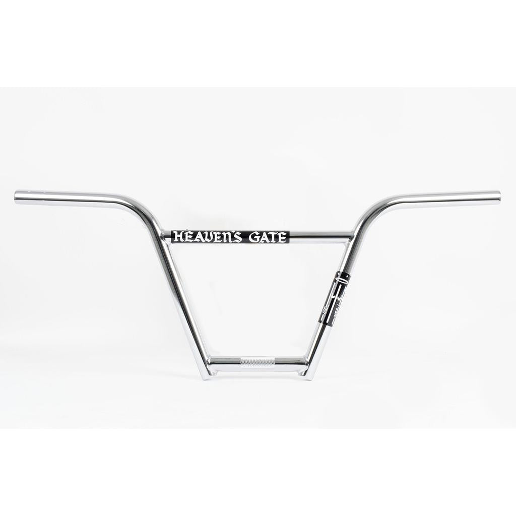The Cult Heaven's Gate 4pc Bars are silver chromoly BMX handlebars featuring a crossbar pad labeled "HEAVEN'S GATE," inspired by the Brandon Begin signature series and shown on a clean white background.