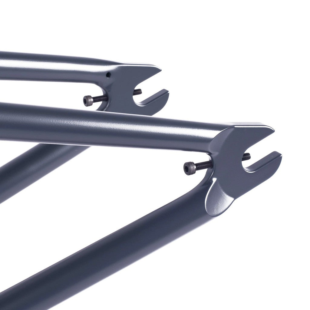 A close up of a pair of Gun Metal colored bike frames, including the Cult Crew Frame (Jaume Sintes Signature) designed by Jaume Sintes.