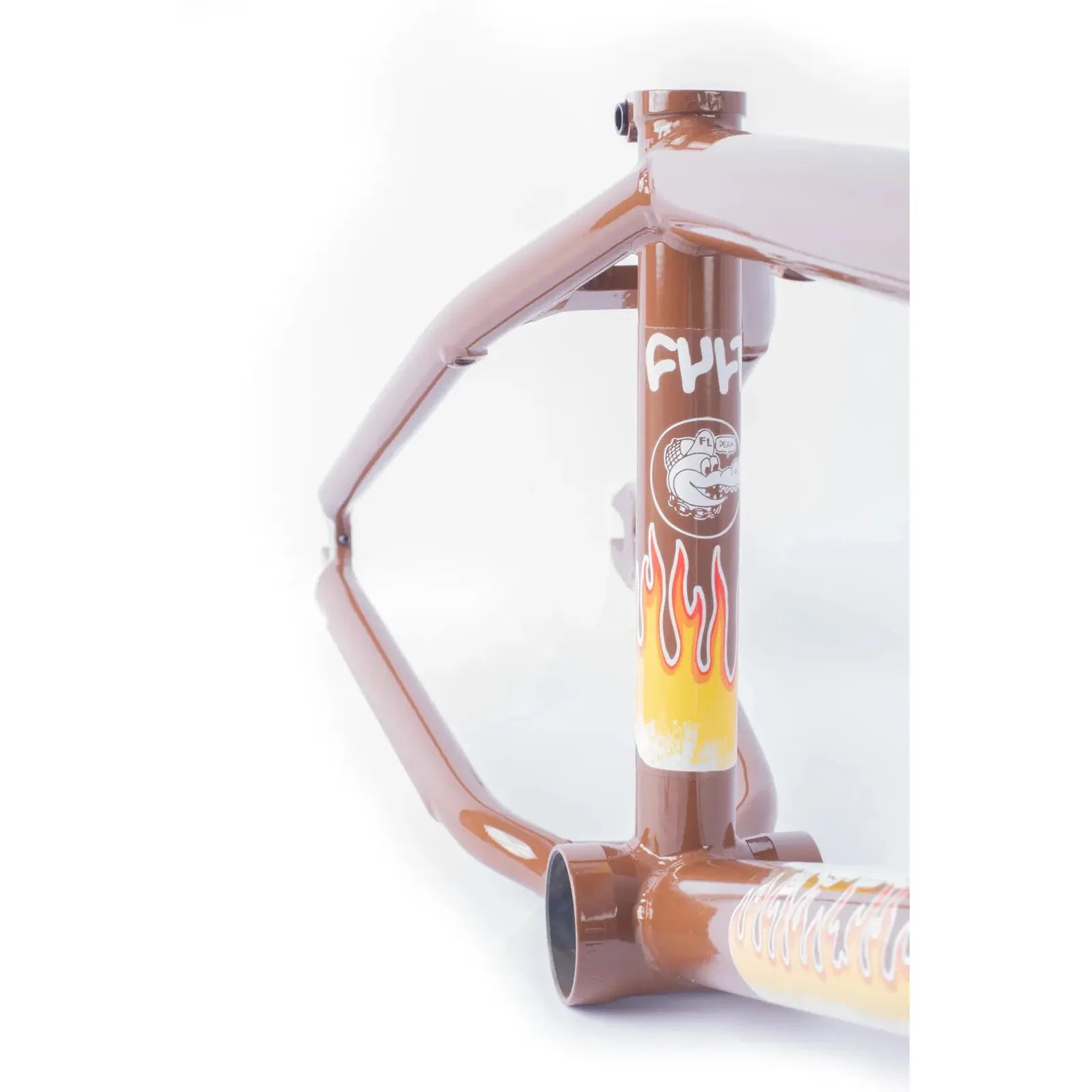 The Cult Trey Jones Frame is a brown BMX frame featuring flame graphics and a cartoon character logo on the front tube, shown against a white background.