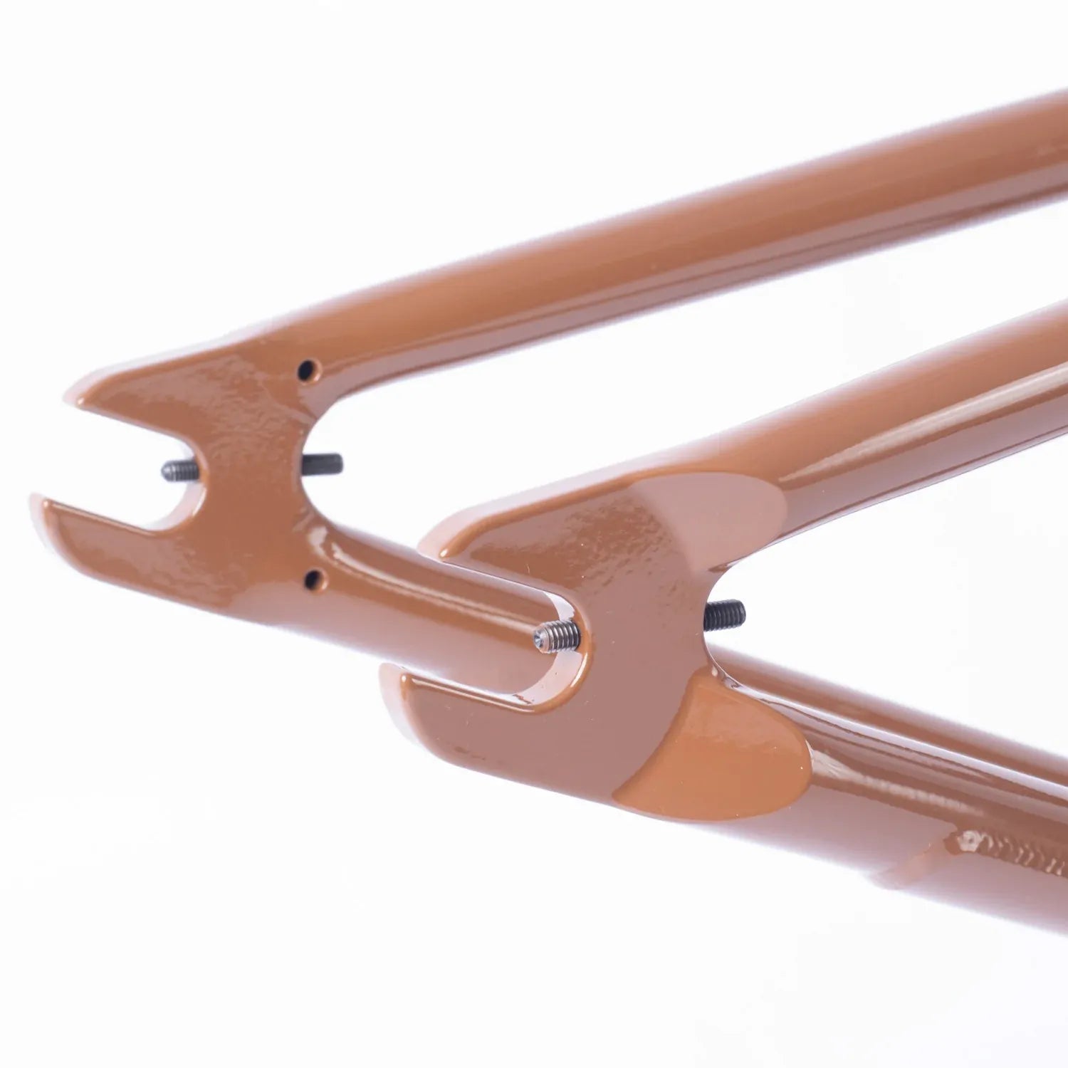 Close-up of two brown Cult Trey Jones Frame BMX dropouts with small bolts, isolated on a white background.