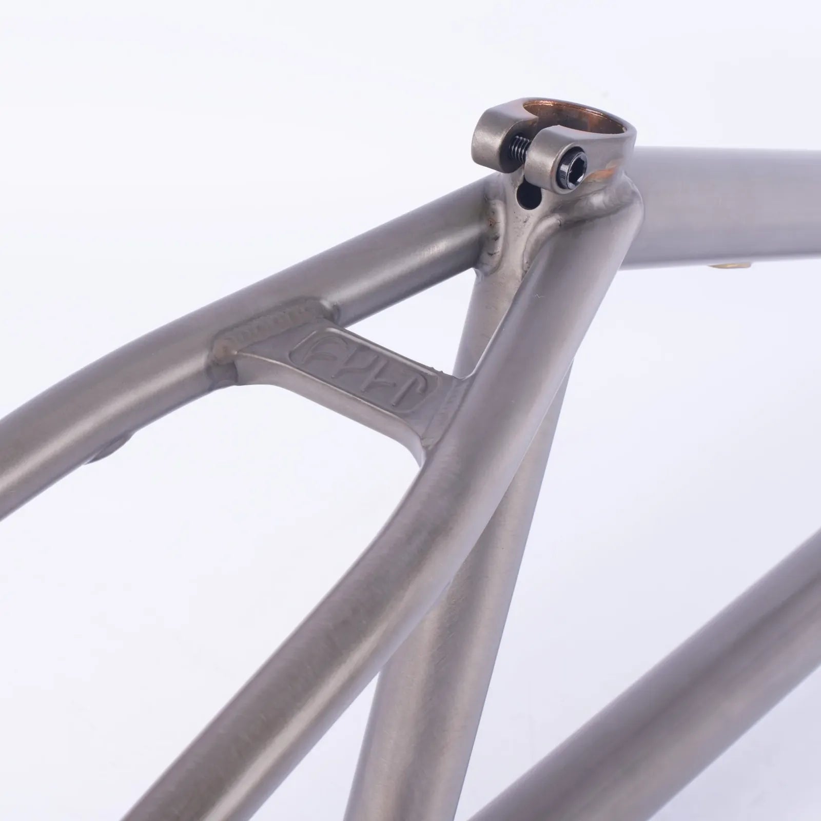 Close-up of the Cult Shorty Killian Roth V2 Frame’s seat stay junction, highlighting the welds, seat tube, and clamp area with a metallic finish for a premium BMX frame look.