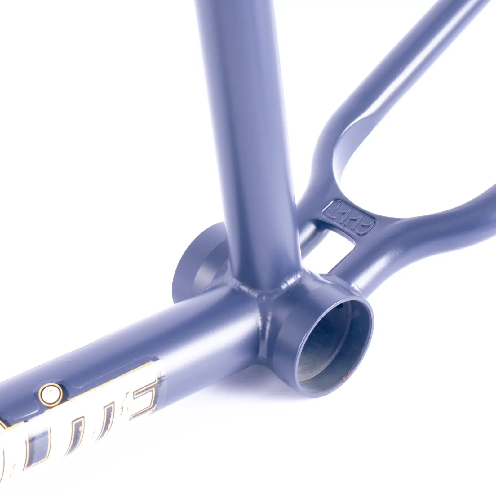 Close-up of the Cult Shorty V2 Sumn Lite Frame in the Eddie Cuellar Colourway, focusing on the blue bottom bracket area with detailed welds and partial brand lettering.