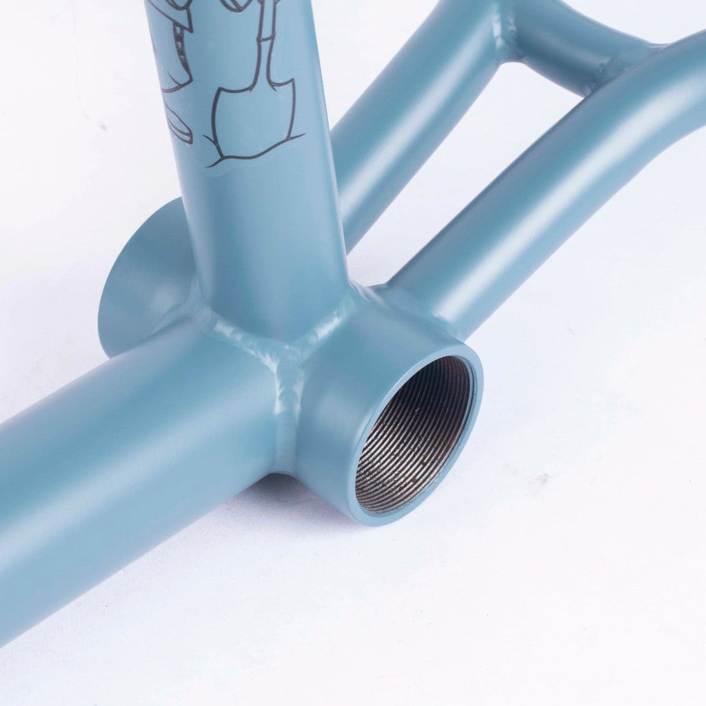 A close up of a Cult Vick Behm Race Frame, featuring a blue color and the signature of Vick Behm.