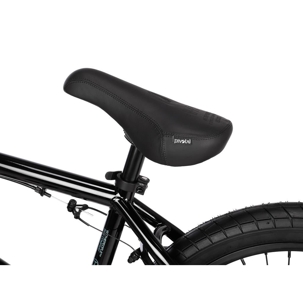 Close-up of a black BMX bike seat, seat post clamp, and rear tire on a Wethepeople Arcade 20 Inch Bike frame.