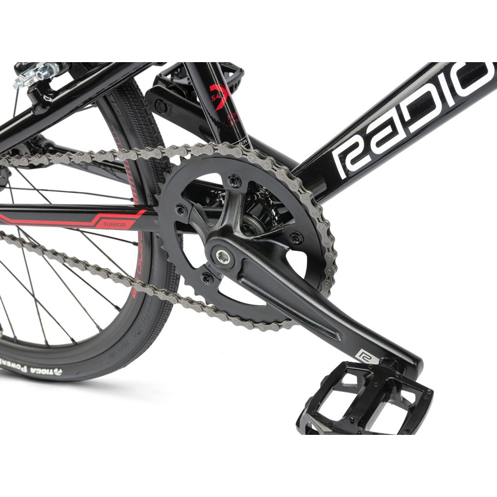 A black Radio Xenon Junior Bike with a chain on it.