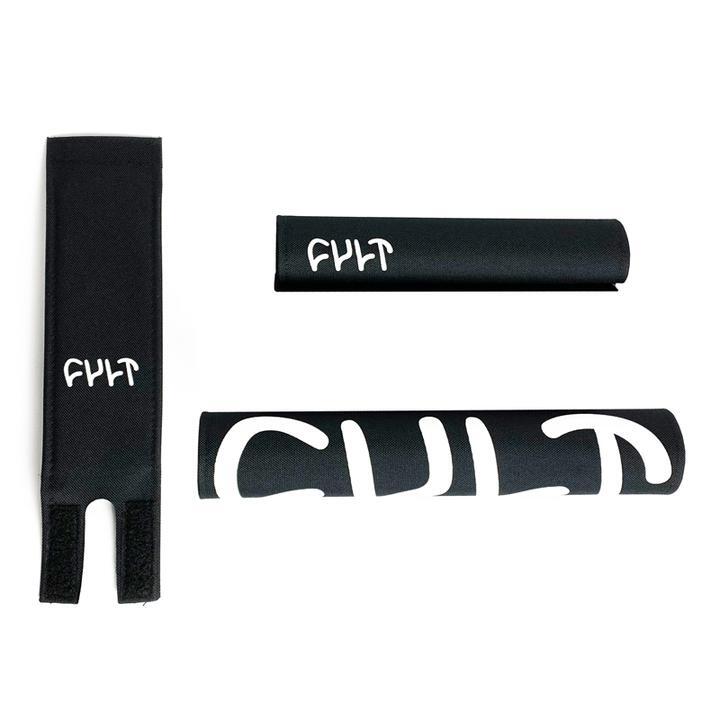 A pair of black Cult Pad Set gloves with the word "ph" on them, designed to protect your hands during intense bar workouts.