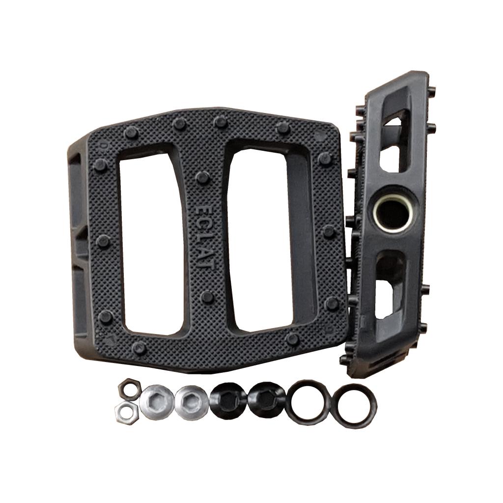 The Eclat Seeker Pedal Body/Hardware includes black pedal bodies with textured surfaces (shown from top and side) plus assorted replacement parts such as nuts, washers, and caps.