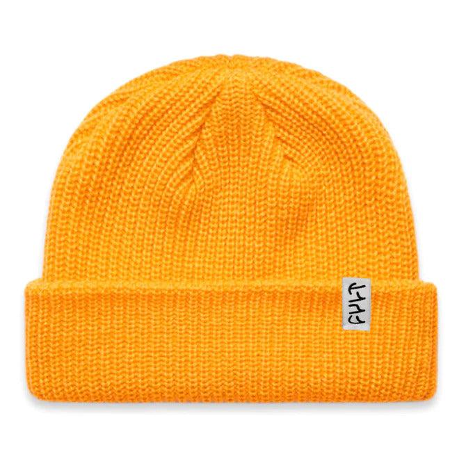 The Cult Nightwatch Beanie is a bright yellow acrylic hat with a folded cuff, featuring a subtle white tag on the side, embodying a classic fisherman style.