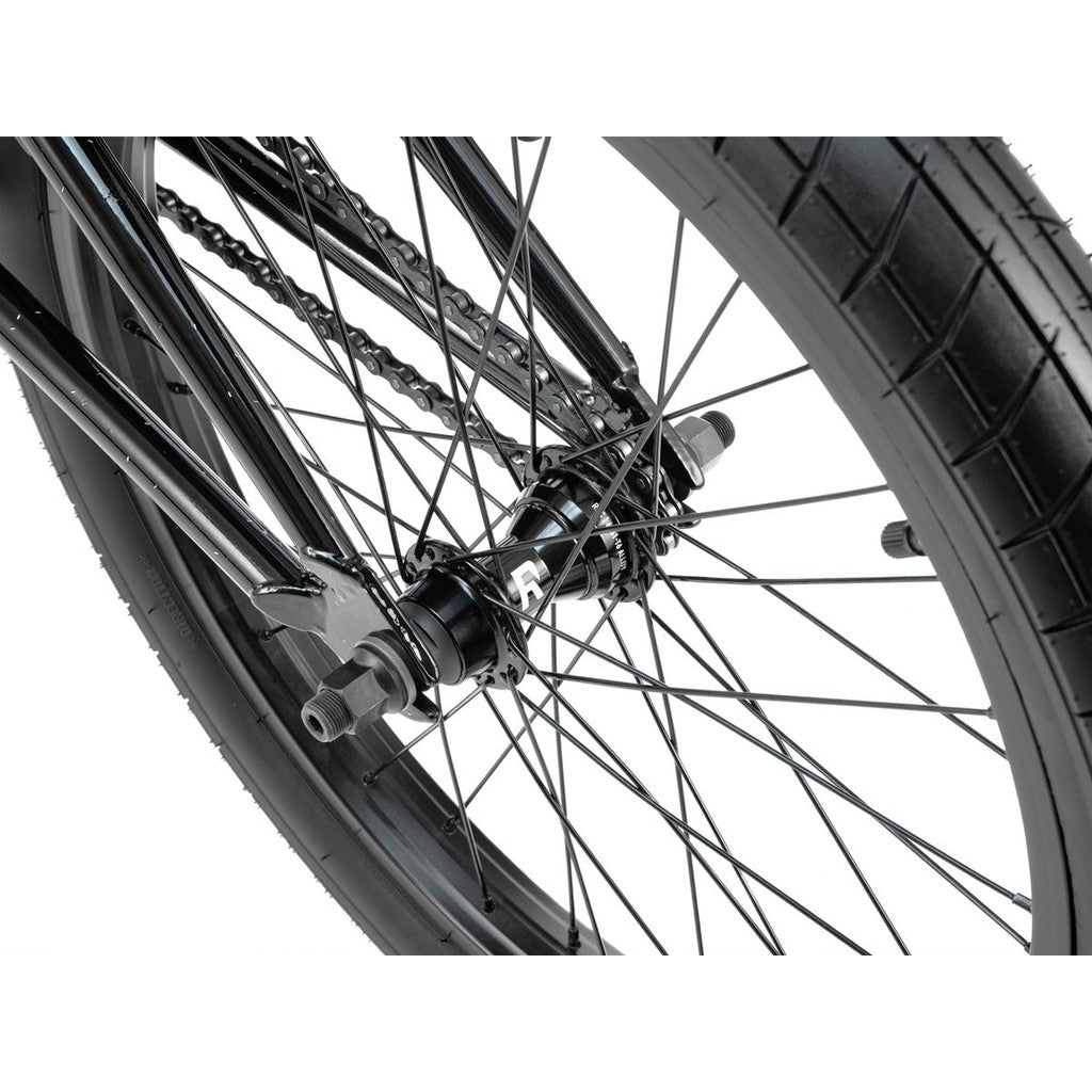 Close-up of a Radio Astron FS 20 Inch Bike wheel showcasing the tire, spokes, chain, and Radio Pro Hubs in a detailed, clear view.
