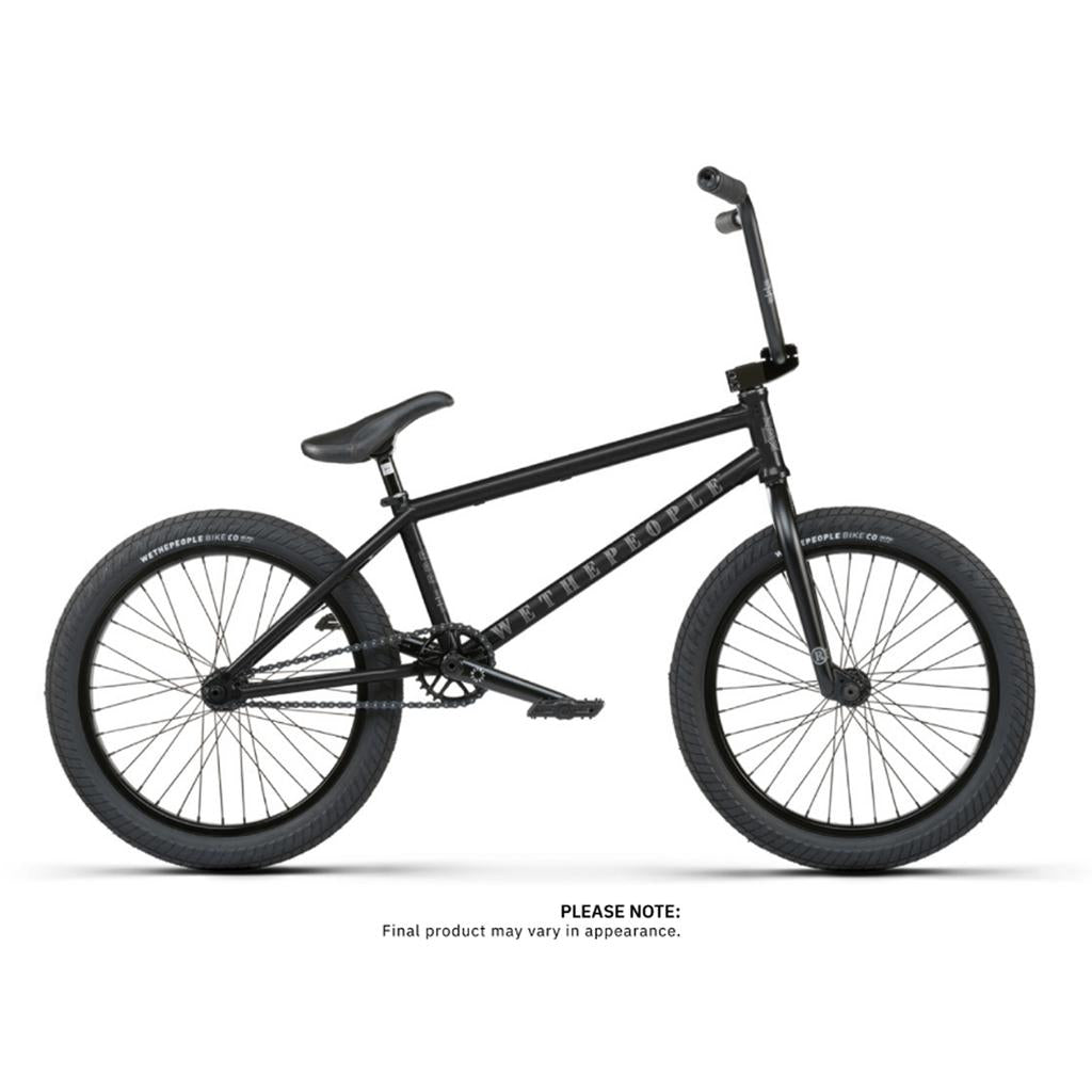 The Wethepeople Revolver 20 Inch Bike, a black BMX with thick tires and a minimalist frame, is displayed against a white background.