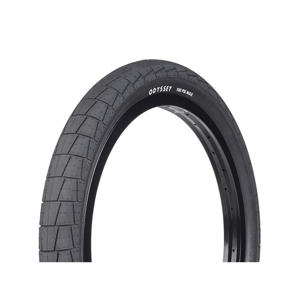 Black 20-inch Odyssey Broc Raiford 20 Inch Tyre with a blocky, patterned tread mounted on a black rim.