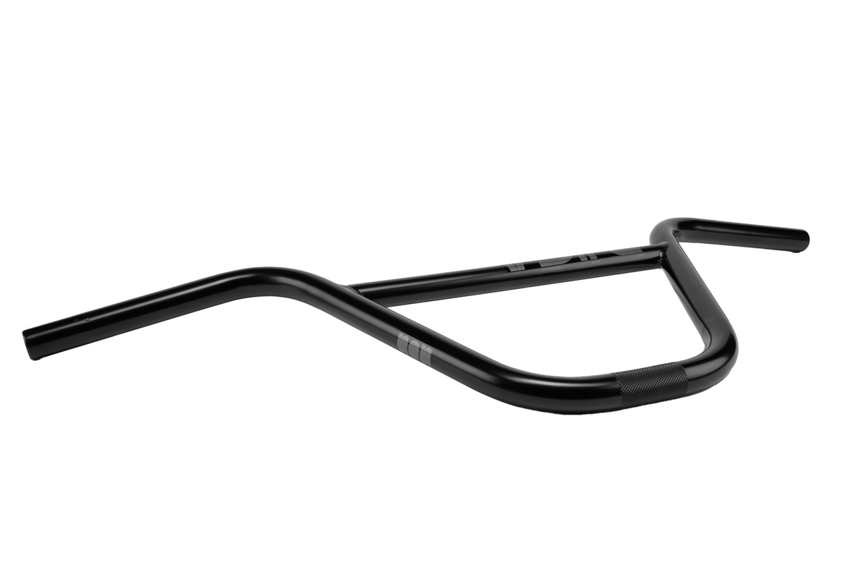 The Wethepeople ARC (Murray Loubser) Bars, featuring an OS 25.4mm clamp, are black BMX street handlebars with an integrated crossbar, crafted from durable 4130 chromoly and displayed against a white background. This design is inspired by Murray Loubser’s signature style.