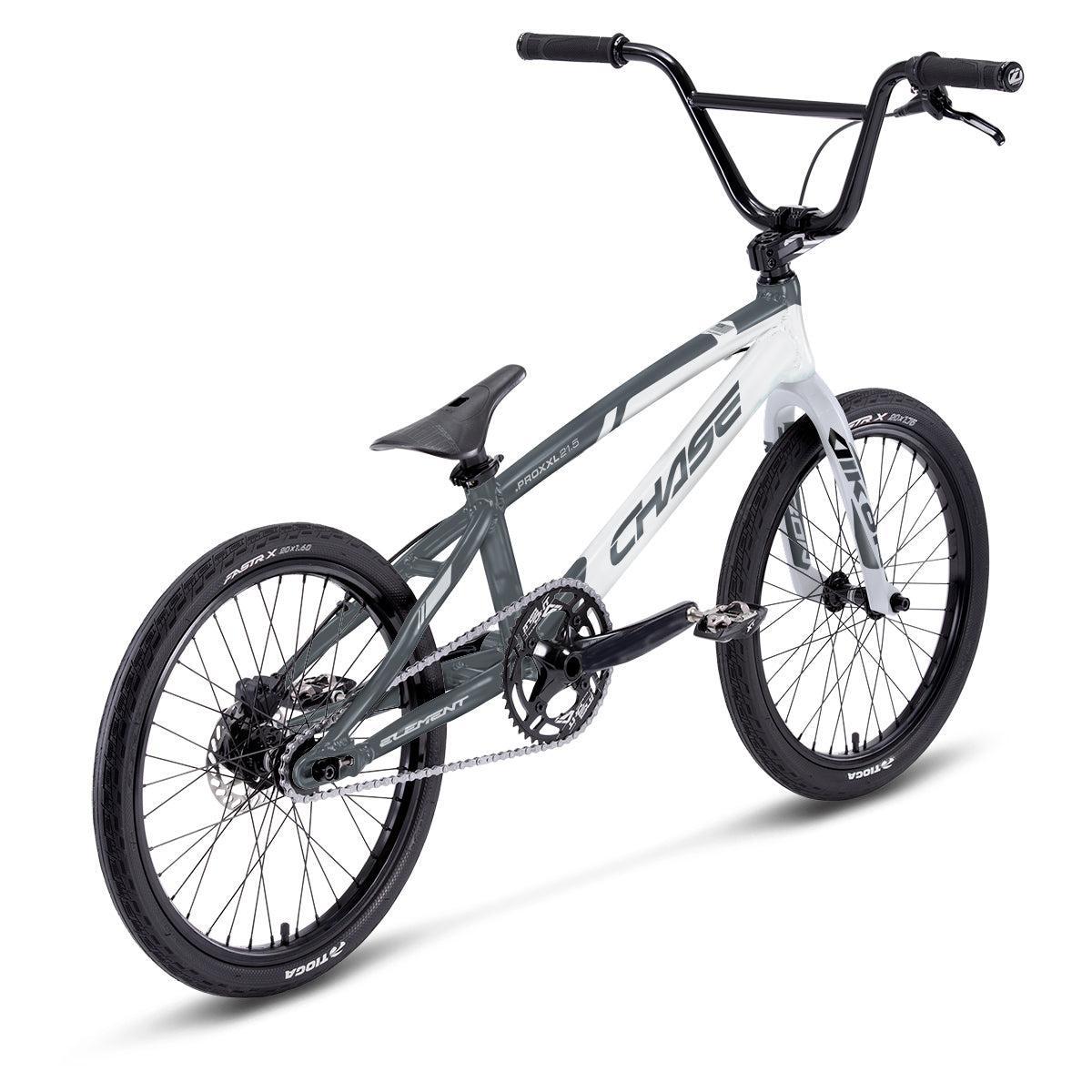 A rear left view of the Chase Element Expert Race Bike (2027), a pro-level BMX featuring a lightweight 7005 T6 alloy frame, flat seat, and knobby tires in a striking black and white color scheme—drawing inspiration from the renowned Chase Element series.
