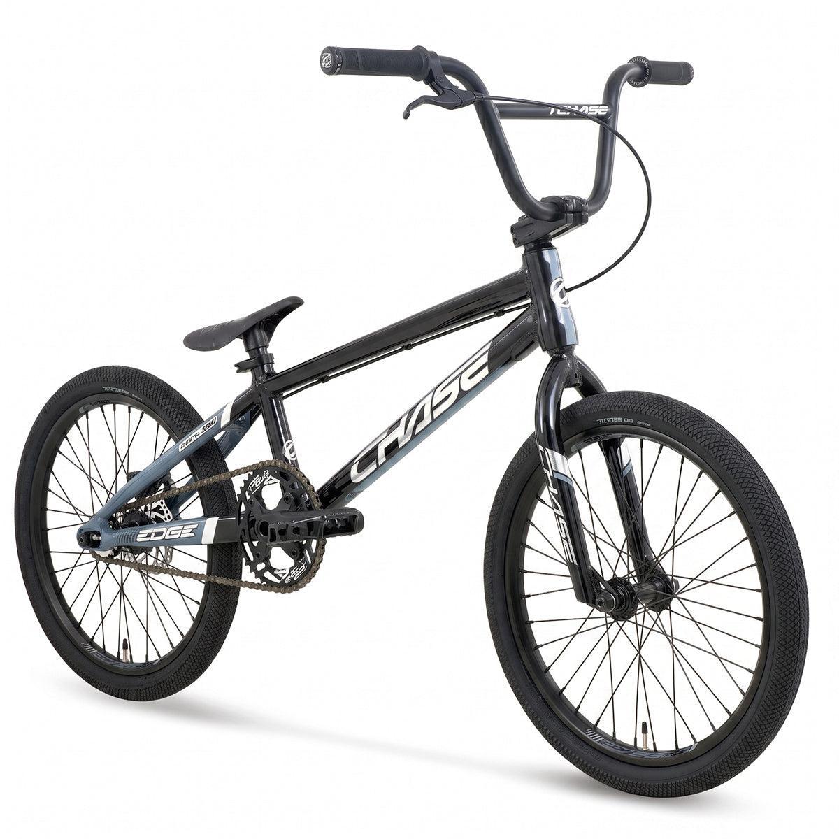 The Chase Edge Expert XL Race Bike (2027) is a black BMX with “CHASE” emblazoned on its hydroformed 6061 aluminium frame, equipped with thick tires, upright handlebars, and a compact seat. Positioned against a white background, this lightweight race bike is built for both performance and style.