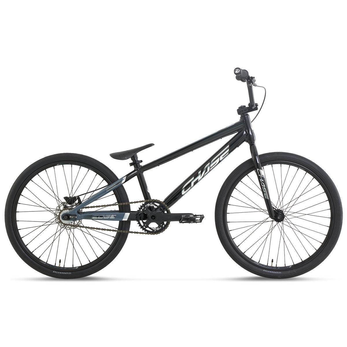 A side view of the Chase Edge Pro Cruiser Race Bike (2027) in black, featuring a hydroformed 6061 aluminium frame, thick tires, flat handlebars, and an integrated head tube. Shown against a white background, this race bike showcases its lightweight design with no visible suspension for optimal performance.