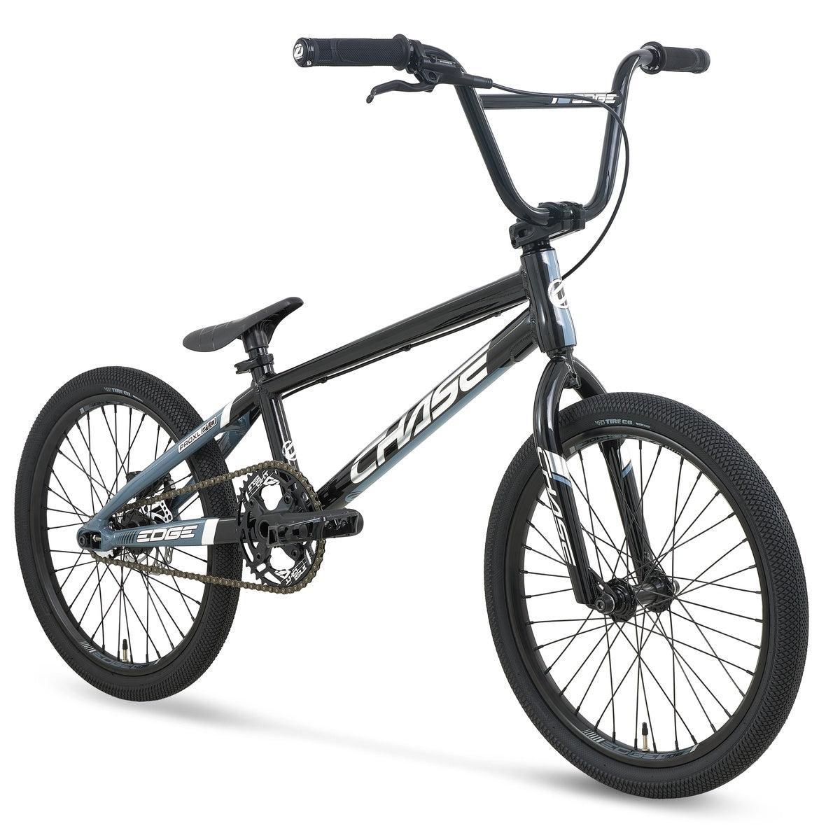 A black Chase Edge Pro XL Race Bike (2027) BMX bicycle with “CHASE” branding on the frame, featuring an integrated head tube, hydroformed 6061 aluminium construction, knobby tires, straight handlebars, and a single gear.