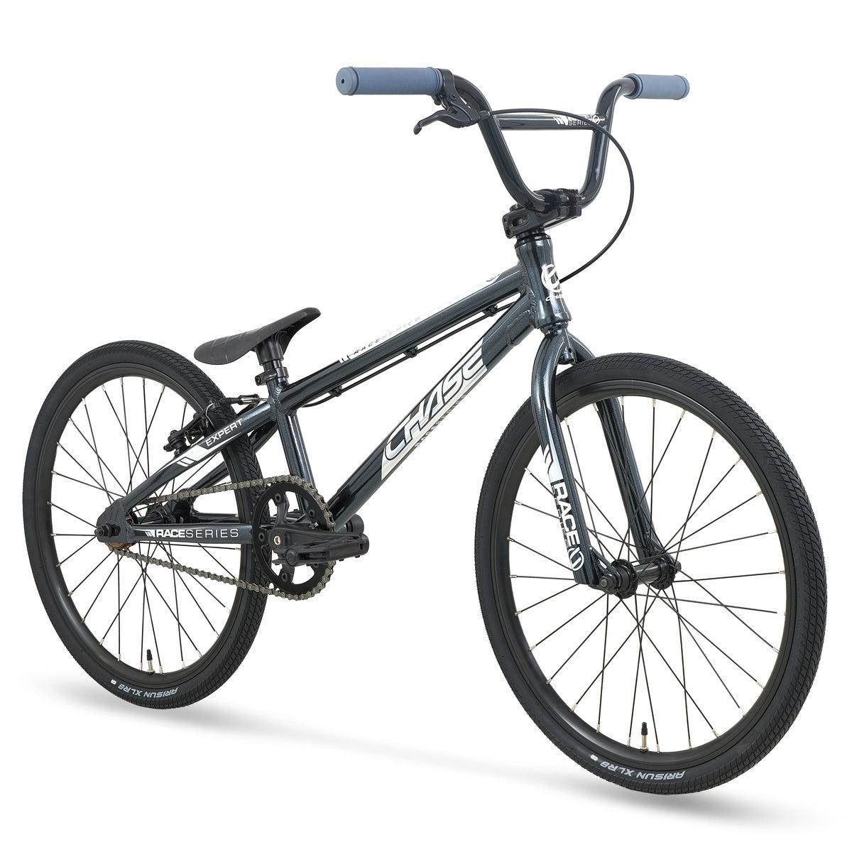 Chase Race Series Expert Race Bike (2027) in black, featuring blue handlebar grips, a padded seat, and thin tires, displayed at a slight angle on a white background—an ideal entry-level race bike for aspiring riders.