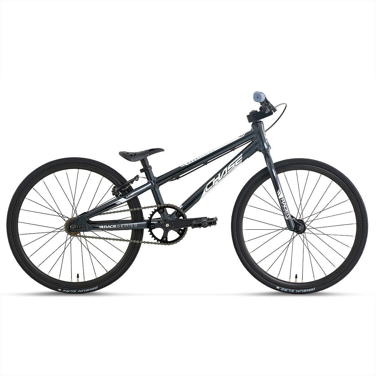 Side view of a Chase Race Series Mini Race Bike (2027) in black, showcasing thin tires, a sloped top tube, straight handlebars, and minimal accessories on a plain white background—ideal as an entry level BMX.