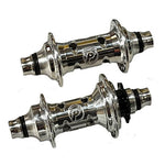 The PROFILE Limited Edition Cat's Eye Hub Set features two polished silver hubs with cutout holes and engraved logos, displayed side by side on a white background—an exclusive choice for discerning cyclists.