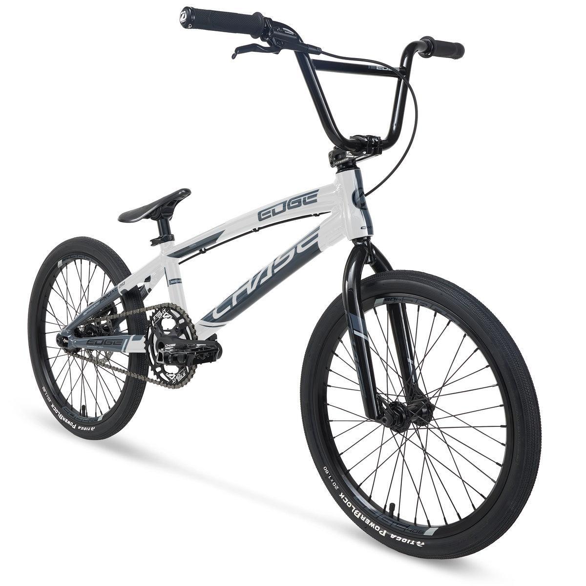 The Chase Edge Pro L Bike (2026) is a white and black BMX featuring a lightweight frame, thick tires, and elevated handlebars, displayed from a front-side angle on a white background.