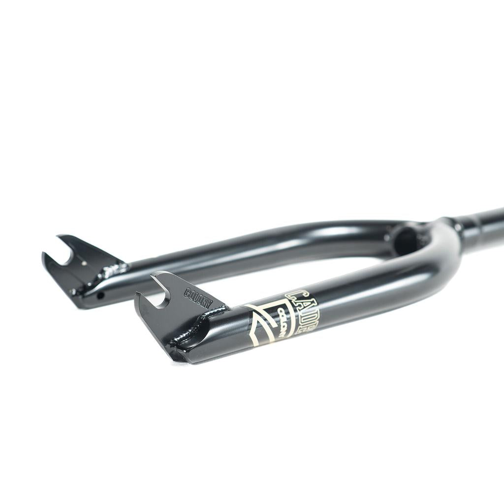 Close-up of a black Colony Cadet 16 Inch Fork with heat-treated CrMo construction and dropouts, photographed on a white background.