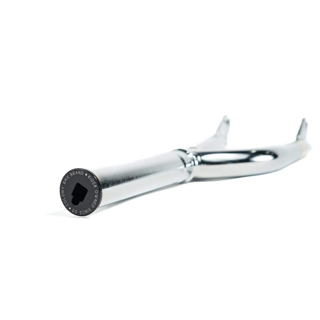 Close-up of Colony Cadet 16 Inch Forks, a metallic BMX fork with black end cap featuring "Colony" and "BMX Brand, Since 05." Made from durable heat-treated CrMo and offers a 25mm offset for reliable performance.