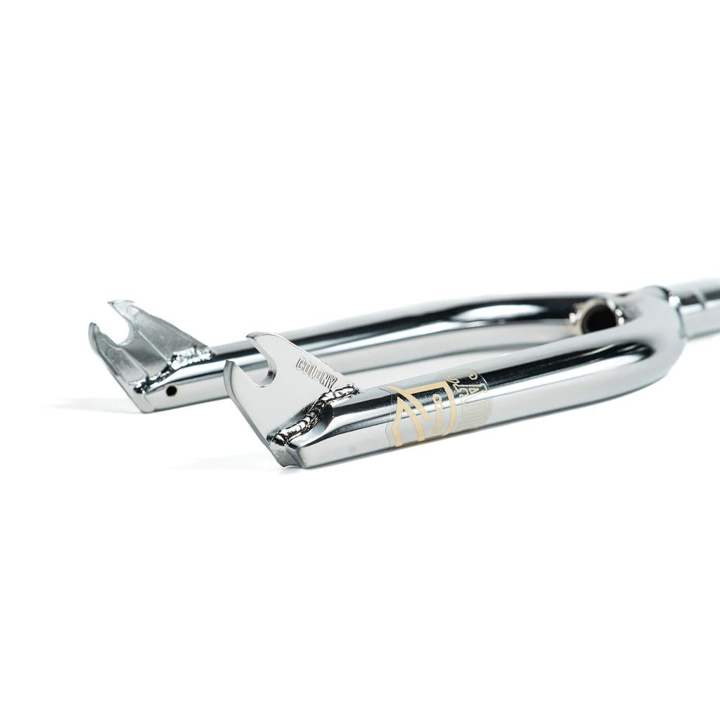 Close-up of a polished chrome dropout on the Colony Cadet 16 Inch Forks, crafted from heat-treated CrMo with precise welding and engraved branding—ideal for young BMX riders.