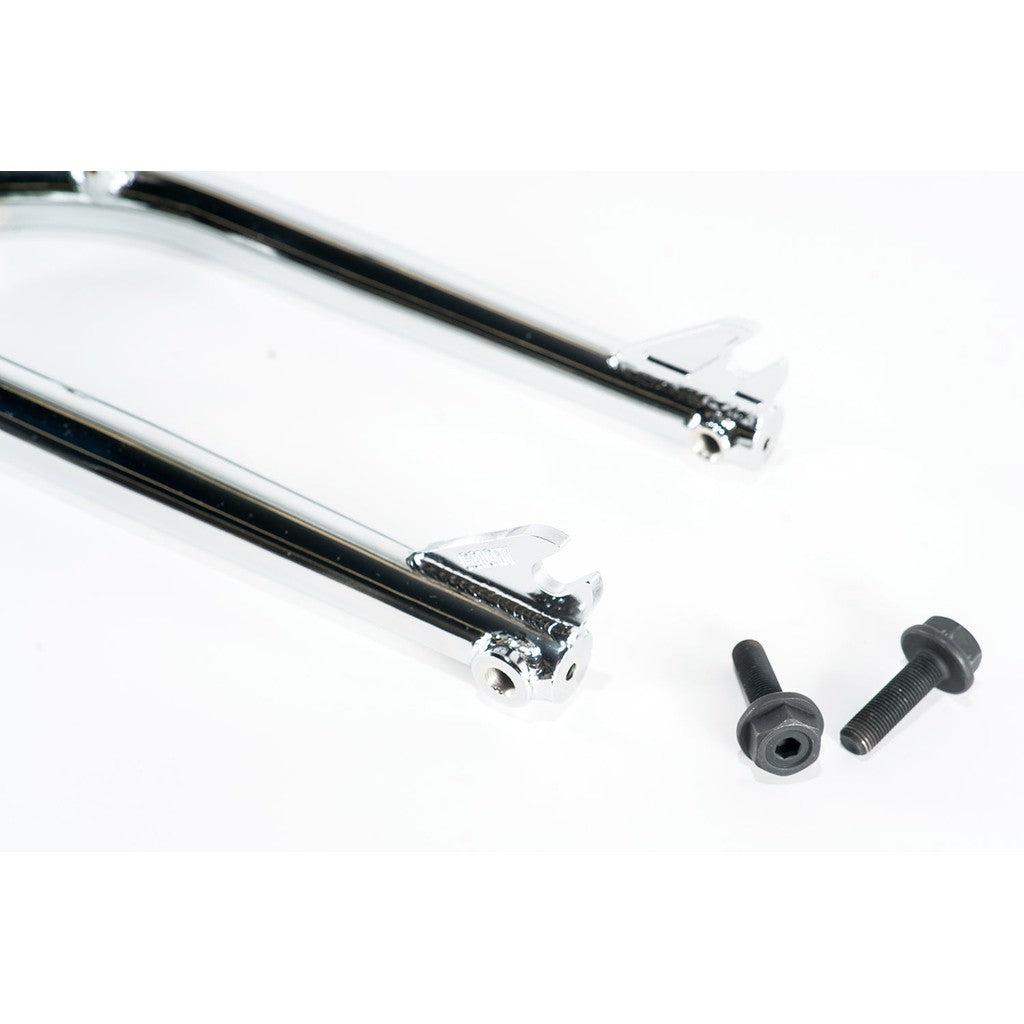 A close-up of the polished Colony Prody Fork (Brake Mounts) with peg bosses and two dark bolts set against a white background.