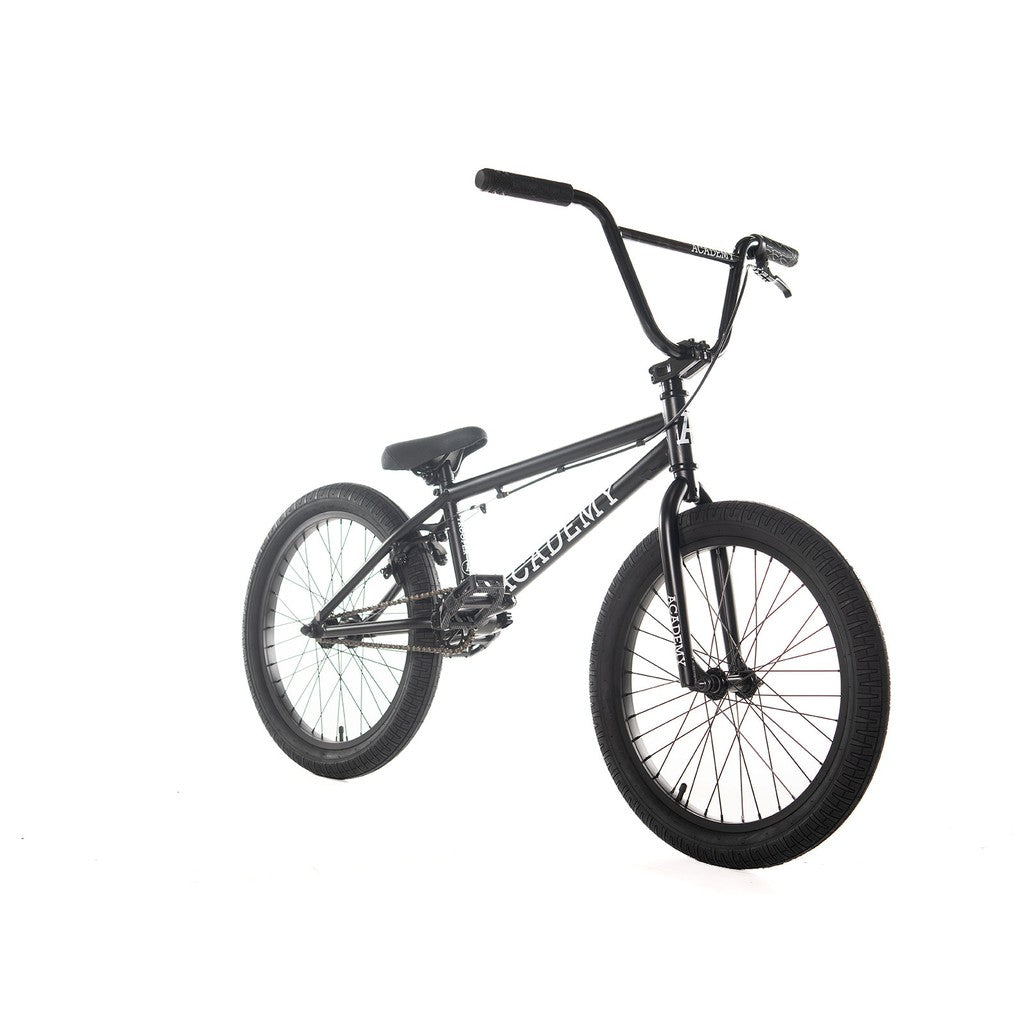 Introducing the Academy Trooper 20 Inch Bike, presented on a white background. This black bike is equipped with a durable Hi-Ten steel frame, thick tires for enhanced stability, straight handlebars, and a comfortable padded seat. Featuring sealed hubs to ensure a smooth riding experience, this bike is perfect for thrill-seekers and adventure enthusiasts.