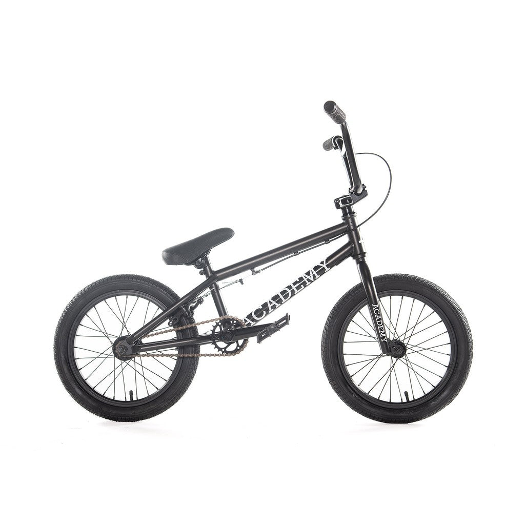 A 16" BMX bike from Academy called the "Inspire," featuring a black CrMo frame with "CADEMA" branding, compact design, thick tires, and a straightforward gear system is showcased against a white background.