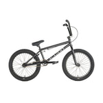 The Academy Trooper 20 Inch Bike is a black beginner BMX with a straight top tube, thick tires, and "ACADEMY" on the frame—shown in side profile. Ideal for youth or anyone seeking a BMX bike for tricks.